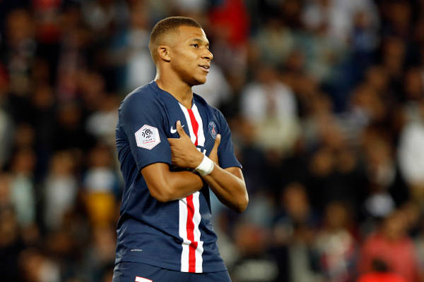 Will Mbappé strike his signature 'hands' pose after every goal in the match against Morocco?